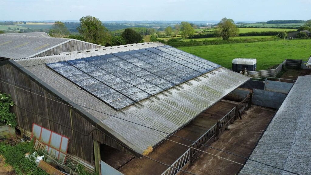A photo of the barn before cleaning by EV Solar A 'before' photo of the same barn before it was cleaned. The solar panels are covered in dirt, grime, and mould.