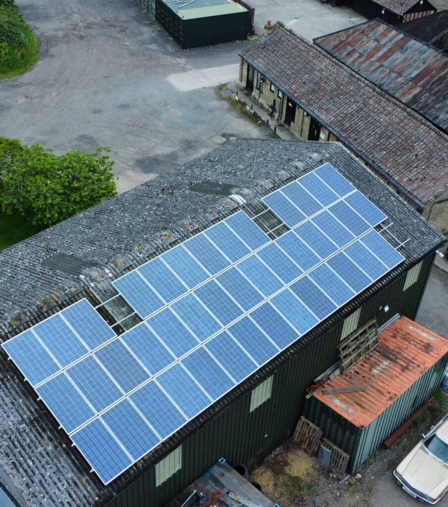 Commercial solar panel cleaning Cambridgeshire Blue solar panels on the roof of barn on a Cambridgeshire farm, cleaned by EV Solar UK