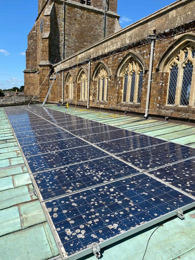Solar panels covered in lichen and moss Oxfordshire solar panels covered in lichen and moss that need professional cleaning by EV Solar