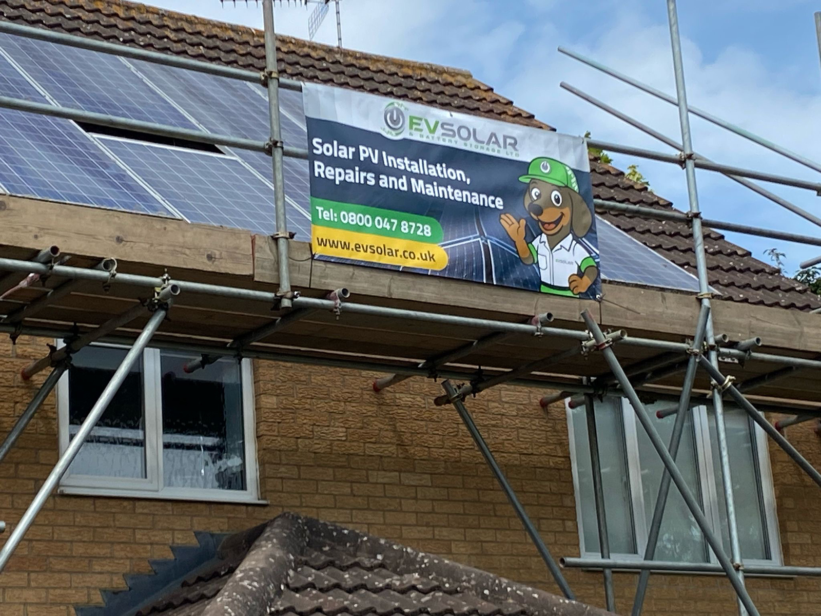 EV Solar unfurls the new Sunny mascot banner at a job site. EV Solar unfurls the new Sunny mascot banner at a job site.