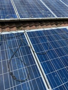 Loose wires scattered across a solar array. EV Solar replaced all of the connectors.