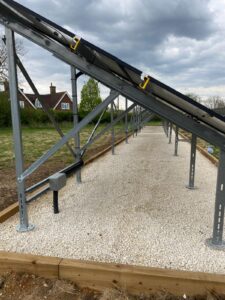 A bespoke ground-mounted framework was designed to accommodate the existing solar panels while providing a strong and stable structure capable of withstanding local weather conditions.