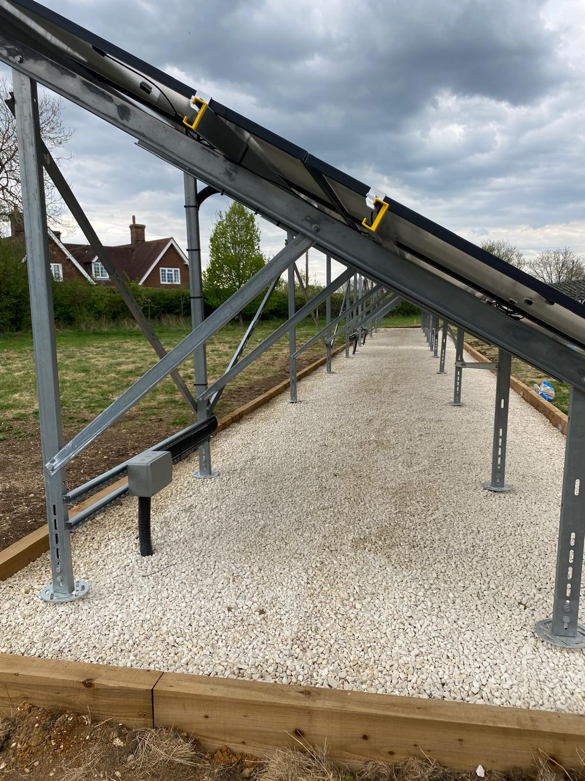 A bespoke ground-mounted framework was designed to accommodate the existing solar panels while providing a strong and stable structure capable of withstanding local weather conditions.