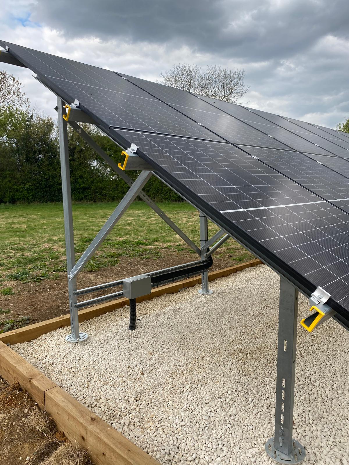Solar cabling was routed through weatherproof electrical enclosures and underground conduit, providing a neat, protected cable management solution between the array and the remainder of the system.