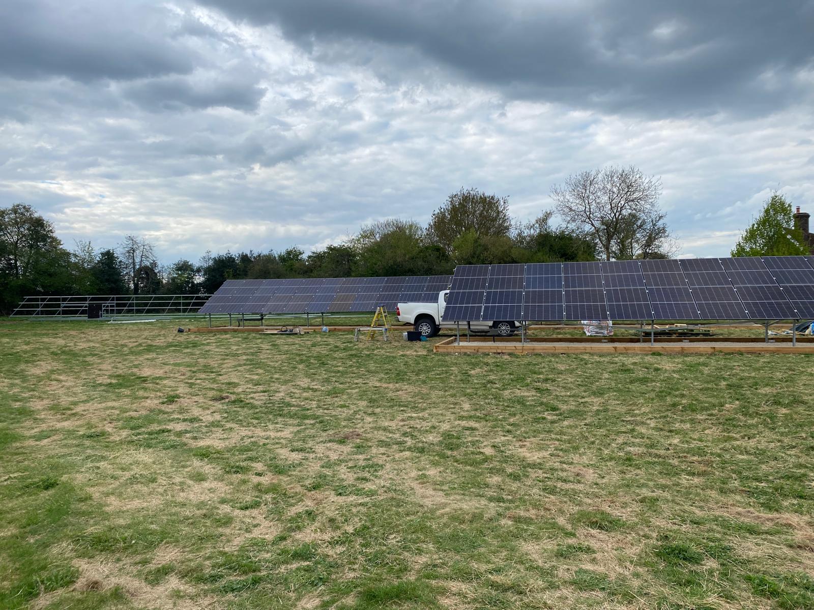 A progress update photo with EV Solar's pickup truck in the background