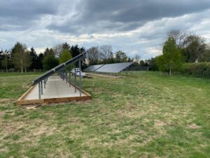 A side view of the ground-mounted solar array with frame